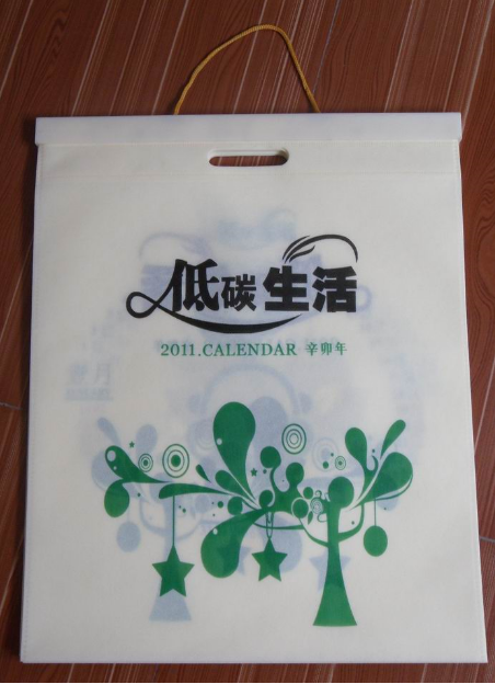 無(wú)紡布袋掛歷批發(fā)，無(wú)紡布掛歷訂做廠家